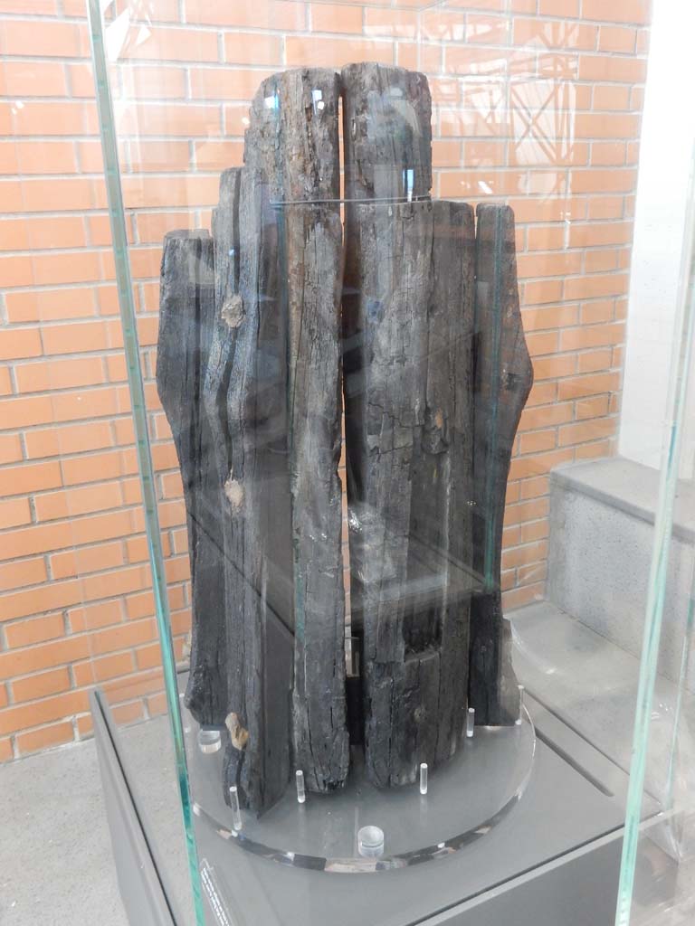 Herculaneum, June 2019. Found in the “area of the new excavations of the Insula Occidentalis”. 
Capstan used for pulling large boats ashore. Photo courtesy of Buzz Ferebee.
According to the information card –
“Even more exceptional is the winch found in the new excavations area of the Insula Occidentalis.
This seems to be a capstan, with its slots for the manoeuvring bars and elements for receiving the rope still well-preserved.
It is likely this was used in a maritime context, as there are direct parallels with the wooden winches used on ships and in ports until the nineteenth century.”